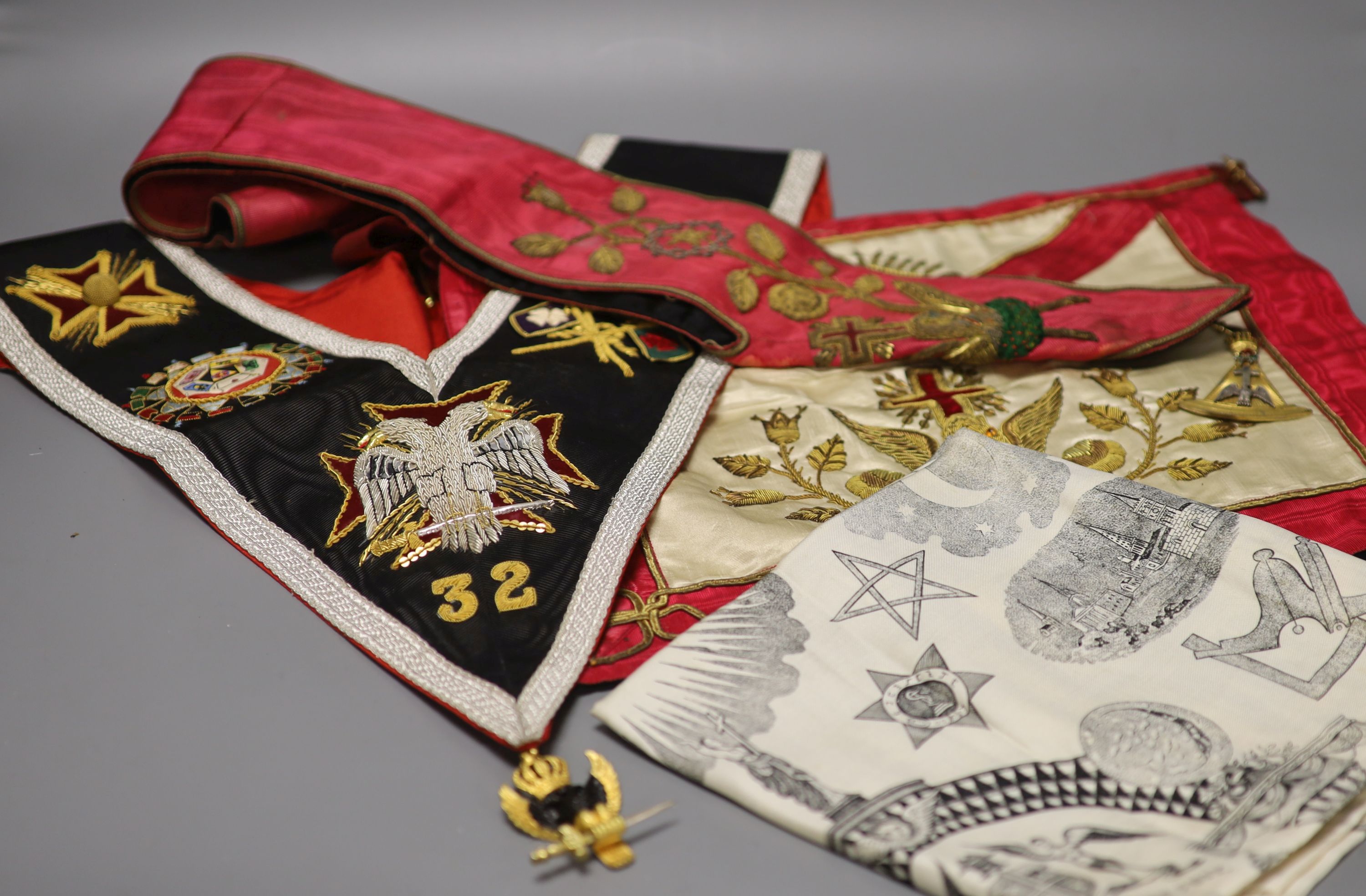 A late 19th early 20th century Masonic bullion worked embroidered and matching sash, plus a modern sash with silver gilt medallion and